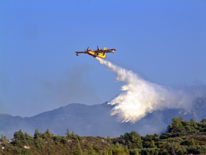 Firefighting plane releasing water